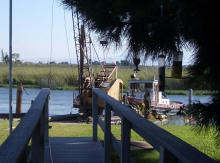 Tug boat and spud barge repairing dock pilings at Bethel Island