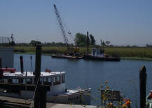 Tug boat and spud barge after repairing dock pilings at Bethel Island